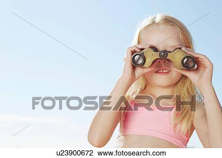 Girl looking through binoculars View Large Photo Image Stock Image - Girl looking through binoculars. Fotosearch