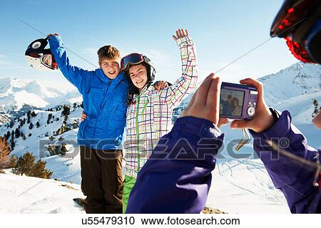 Girl photographing siblings, Les Arcs, Haute-Savoie, France View Large Photo Image Stock Image - Girl photographing siblings, Les Arcs, Haute-Savoie, France. Fotosearch