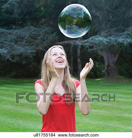 Girl playing with bubble View Large Photo Image Picture - Girl playing with bubble. Fotosearch