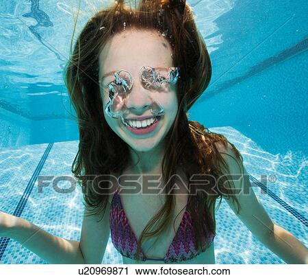 Girl underwater in swimming pool View Large Photo Image Stock Image - Girl underwater in swimming pool. Fotosearch