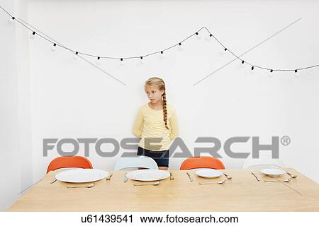 Girl waiting by table with empty plates View Large Photo Image Stock Image - Girl waiting by table with empty plates. Fotosearch