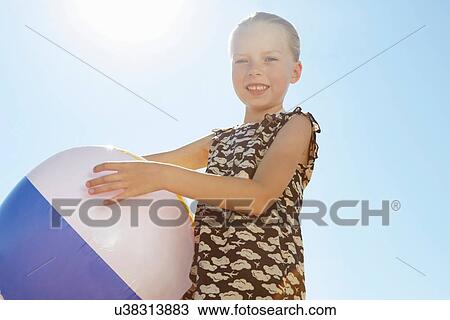 Girl with beach ball View Large Photo Image Stock Image - Girl with beach ball. Fotosearch