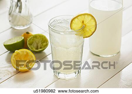 Glass of homemade lemonade with slice of lemon View Large Photo Image Stock Image - Glass of homemade lemonade with slice of lemon. Fotosearch