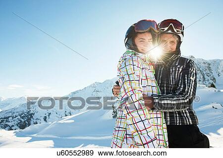 Stock Photo - Grandmother and granddaughter hugging, Les Arcs, Haute-Savoie, France. Fotosearch