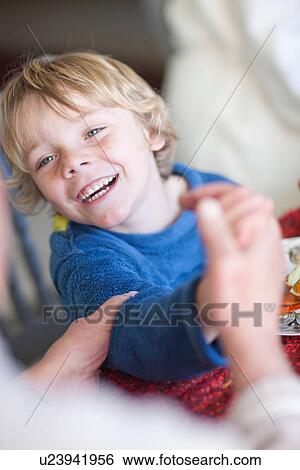 Stock Photograph - Grandmother holding grandsons hand. Fotosearch