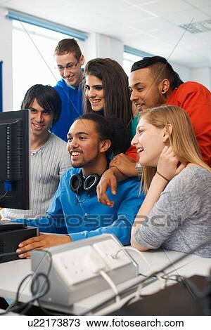 Group of college students using computer View Large Photo Image Stock Image - Group of college students using computer. Fotosearch