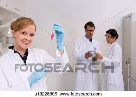 Group of scientists at work in laboratory, Cell culture suspension (front), which is later used for western blot technique (back) to see which proteins are pathologically expressed View Large Photo Image Stock Photograph - Group of scientists at work in laboratory, Cell culture suspension (front), which is later used for western blot technique (back) to see which proteins are pathologically expressed. Fotosearch