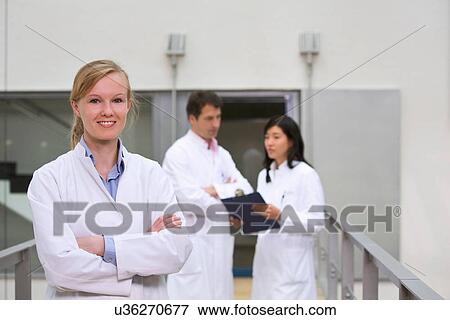 Stock Photo - Group of scientists in atrium. Fotosearch