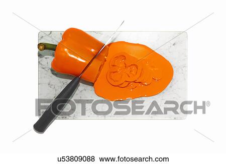 Kitchen knife cutting orange pepper View Large Photo Image Stock Photo - Kitchen knife cutting orange pepper. Fotosearch