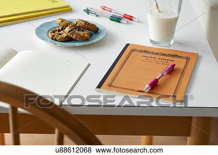 Kitchen table still life with notebooks, biscuits and milk View Large Photo Image Stock Photo - Kitchen table still life with notebooks, biscuits and milk. Fotosearch