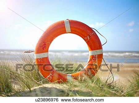 Life ring on beach View Large Photo Image Stock Photograph - Life ring on beach. Fotosearch