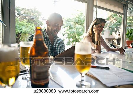 Man and woman at cafe View Large Photo Image Stock Image - Man and woman at cafe. Fotosearch
