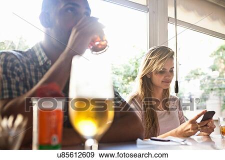 Man and woman at cafe View Large Photo Image Stock Photo - Man and woman at cafe. Fotosearch
