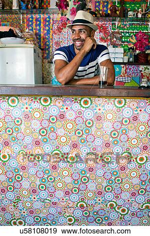 Man at counter of cafe bar View Large Photo Image Stock Photo - Man at counter of cafe bar. Fotosearch