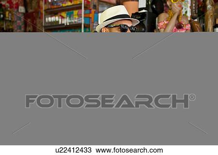 Man in hat and sunglasses with glass of wine View Large Photo Image Stock Image - Man in hat and sunglasses with glass of wine. Fotosearch