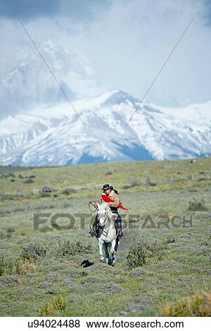 Man riding horse, Patagonia, Chile View Large Photo Image Stock Photo - Man riding horse, Patagonia, Chile. Fotosearch