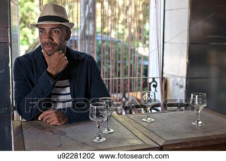 Man waiting in cafe View Large Photo Image Stock Image - Man waiting in cafe. Fotosearch