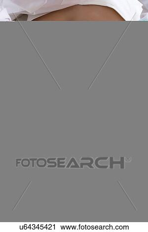 Masseuse pressing down on woman's back View Large Photo Image Stock Image - Masseuse pressing down on woman's back. Fotosearch