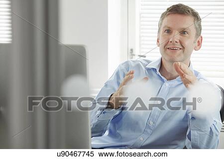 Mature businessman gesturing View Large Photo Image Stock Photography - Mature businessman gesturing. Fotosearch