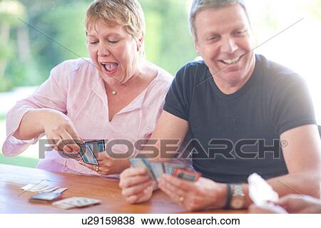 Mature male playing cards with sister View Large Photo Image Stock Photo - Mature male playing cards with sister. Fotosearch
