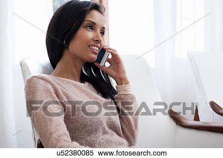 Stock Photography - Mature woman on cell phone. Fotosearch