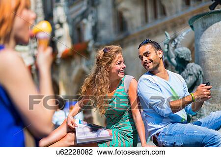 Stock Image - Mid adult couple on vacation. Fotosearch