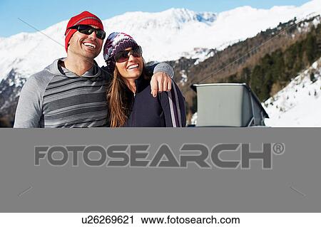 Mid adult couple with car in background, Obergurgl, Austria View Large Photo Image Stock Image - Mid adult couple with car in background, Obergurgl, Austria. Fotosearch