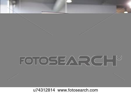 Mid adult man checking door in car showroom View Large Photo Image Picture - Mid adult man checking door in car showroom. Fotosearch