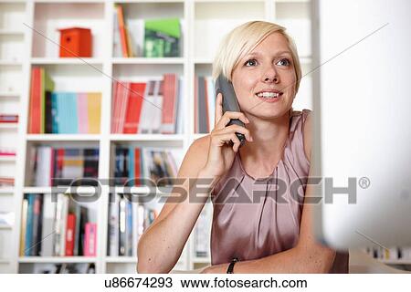 Mid adult woman on landline phone View Large Photo Image Stock Image - Mid adult woman on landline phone. Fotosearch