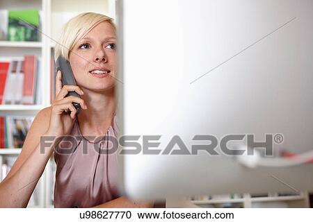 Mid adult woman on landline phone View Large Photo Image Stock Image - Mid adult woman on landline phone. Fotosearch