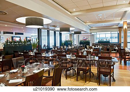 Stock Image - Modern restaurant in hotel. Fotosearch