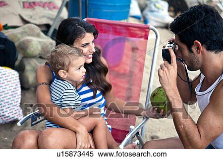 Mother and son, father taking photograph View Large Photo Image Stock Photography - Mother and son, father taking photograph. Fotosearch