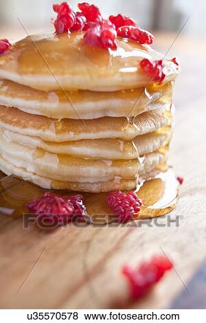 Pancakes with raspberries and syrup View Large Photo Image Stock Photo - Pancakes with raspberries and syrup. Fotosearch