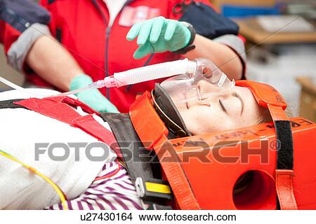 Paramedic monitoring patient in hospital View Large Photo Image Picture - Paramedic monitoring patient in hospital. Fotosearch