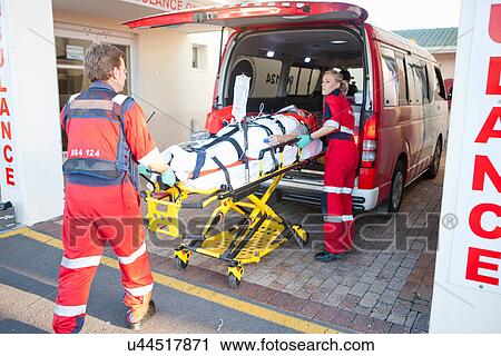 Paramedics lifting patient from ambulance View Large Photo Image Stock Image - Paramedics lifting patient from ambulance. Fotosearch