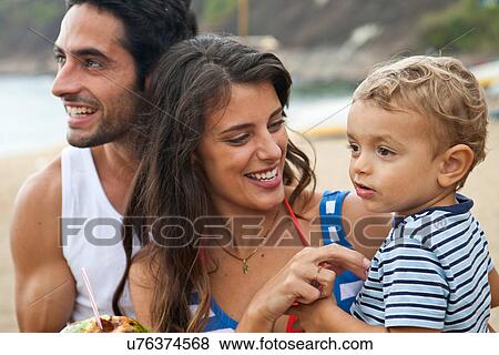 Parents with young son, close up View Large Photo Image Stock Photo - Parents with young son, close up. Fotosearch
