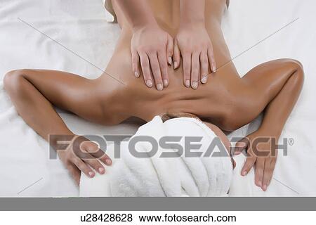 Person massaging woman's back View Large Photo Image Stock Photo - Person massaging woman's back. Fotosearch