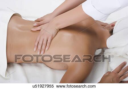 Person massaging woman's back View Large Photo Image Stock Photography - Person massaging woman's back. Fotosearch