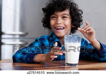 Portrait of boy with glass of milk View Large Photo Image Stock Image - Portrait of boy with glass of milk. Fotosearch
