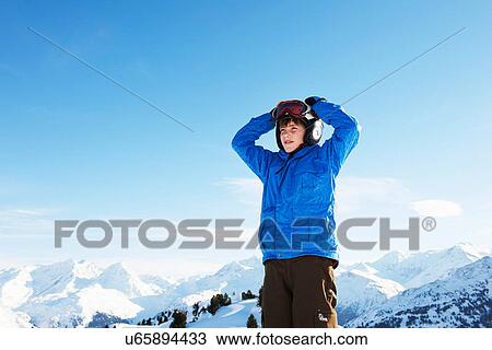 Portrait of boy with hands on head, Les Arcs, Haute-Savoie, France View Large Photo Image Stock Image - Portrait of boy with hands on head, Les Arcs, Haute-Savoie, France. Fotosearch