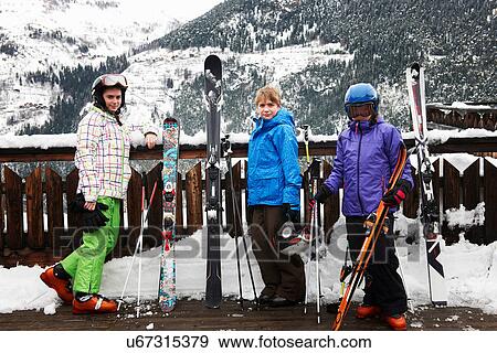 Portrait of brother and sisters holding skis View Large Photo Image Stock Photo - Portrait of brother and sisters holding skis. Fotosearch
