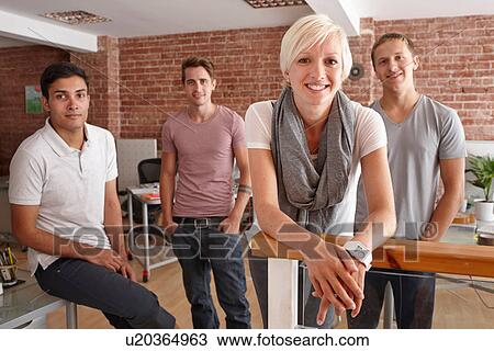 Stock Image - Portrait of colleagues in creative office. Fotosearch