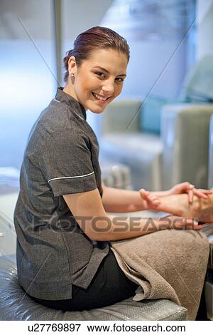 Portrait of masseur in spa treatment room View Large Photo Image Stock Photo - Portrait of masseur in spa treatment room. Fotosearch