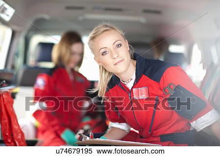 Portrait of paramedics in ambulance View Large Photo Image Stock Photography - Portrait of paramedics in ambulance. Fotosearch