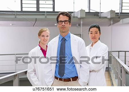 Portrait of three scientists in laboratory atrium View Large Photo Image Stock Image - Portrait of three scientists in laboratory atrium. Fotosearch