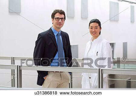 Stock Photo - Portrait of two scientists in laboratory. Fotosearch