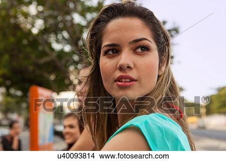 Portrait of young brunette woman looking away View Large Photo Image Picture - Portrait of young brunette woman looking away. Fotosearch