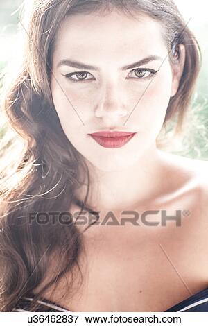 Portrait of young brunette woman looking at camera View Large Photo Image Stock Photo - Portrait of young brunette woman looking at camera. Fotosearch