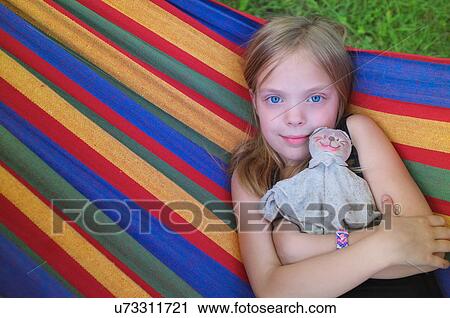 Portrait of young girl in hammock View Large Photo Image Stock Image - Portrait of young girl in hammock. Fotosearch