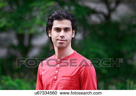 Portrait of young man wearing red top View Large Photo Image Stock Image - Portrait of young man wearing red top. Fotosearch